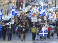 Pro-Bill 101 protestors chanting "Montreal Francaise," march along St. Laurent Boulevard in Chinatown, Montreal, Sunday April 11, 2010.