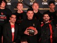Jack James High School basketball players pose with Canadian Elite Basketball League Commissioner Mike Morreale (holding basketball) and Calgary Surge owners Usman Tahir Jutt, left, and Jason Ribeiro.
