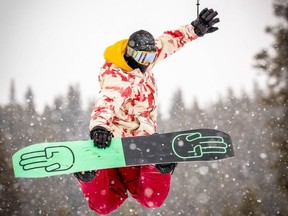 Thos snowboarder hangs loose at Lake Louise Ski Resort on opening day. The ski season is underway in the Canadian Rockies. Al Charest, Postmedia