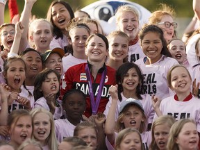 FILE PHOTO: Young female soccer players take a giant selfie photo with Team Canada's Diana Matheson (centre) during halftime at a NASL game between FC Edmonton and Indy Eleven at Clarke Stadium in Edmonton, Alta. on Saturday, May 27, 2017.