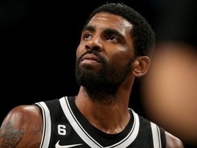 Brooklyn Nets guard Kyrie Irving reacts during the fourth quarter against the Orlando Magic at Barclays Center.