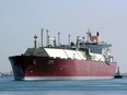 A Qatari liquefied natural gas carrier passes through the Suez Canal near the Egyptian port city of Ismailia.
