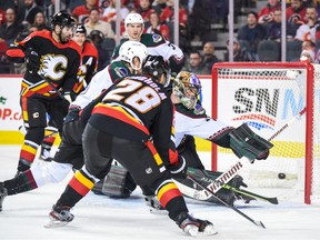 Calgary Flames forward Elias Lindholm scores against Arizona Coyotes goaltender Karel Vejmelka at Scotiabank Saddledome in Calgary on Monday, Dec. 5, 2022.