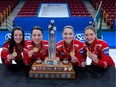 Team Canada skip Kerri Einarson, third Val Sweeting, second Shannon Birchard and lead Briane Meilleur, left to right, pose with the trophy and medals after winning the Scotties Tournament of Hearts at Fort William Gardens in Thunder Bay, Ont., Sunday, Feb. 6, 2022. Team Canada defeated Northern Ontraio 9-6.