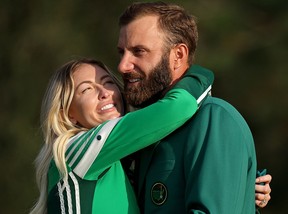 Dustin Johnson celebrates with fiancée Paulina Gretzky after winning the Masters at Augusta National Golf Club in 2020.