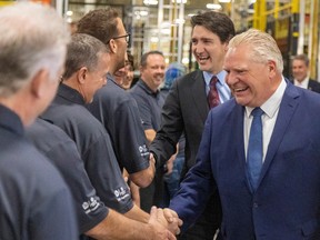 Industrial policy is back in vogue in push for Canada to win on green economy - google news - Finance - Public News Time Prime Minister Justin Trudeau and Ontario Premier Doug Ford meet with workers at an auto plant in Ontario.