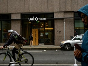 Fallout from sale of Credit Suisse prompts Canada's banking regulator to soothe bond holders - cnbc news today - Finance - Public News Time Pedestrians and a cyclist pass by the Silicon Valley Bank branch office in downtown San Francisco, on March 13.