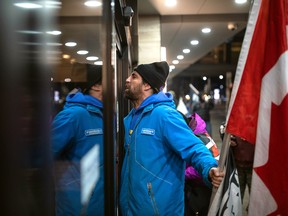 Large, angry protests target Trudeau government cabinet retreat in Hamilton - alberta breaking news Protestors yell at the door of a hotel where Prime Minister Justin Trudeau is staying during the Liberal Cabinet retreat, in downtown Hamilton, Ont., on January 24, 2023.