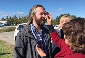 Stratford Beacon Herald reporter Galen Simmons has his hair and makeup touched up by makeup artist G.G. Martin and hairstylist Shari LeBlanc before stepping in as an extra in a scene for AKOOLFILM Company’s upcoming film, Cry of Silence. (Photo by Fern Pridham)