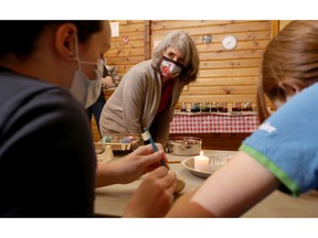 Granda Kopytko teaches some Girl Guides how to paint Ukrainian Easter eggs this week.