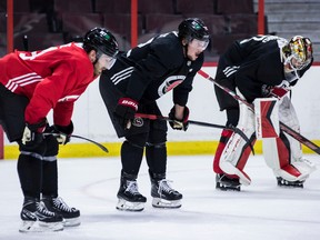 Teammates (left to right) Tyler Mott, Thomas Chabot and Mats Sogard hold their breath during an on-ice session at Training Camp at the Canadian Tire Center on September 22, 2022.
