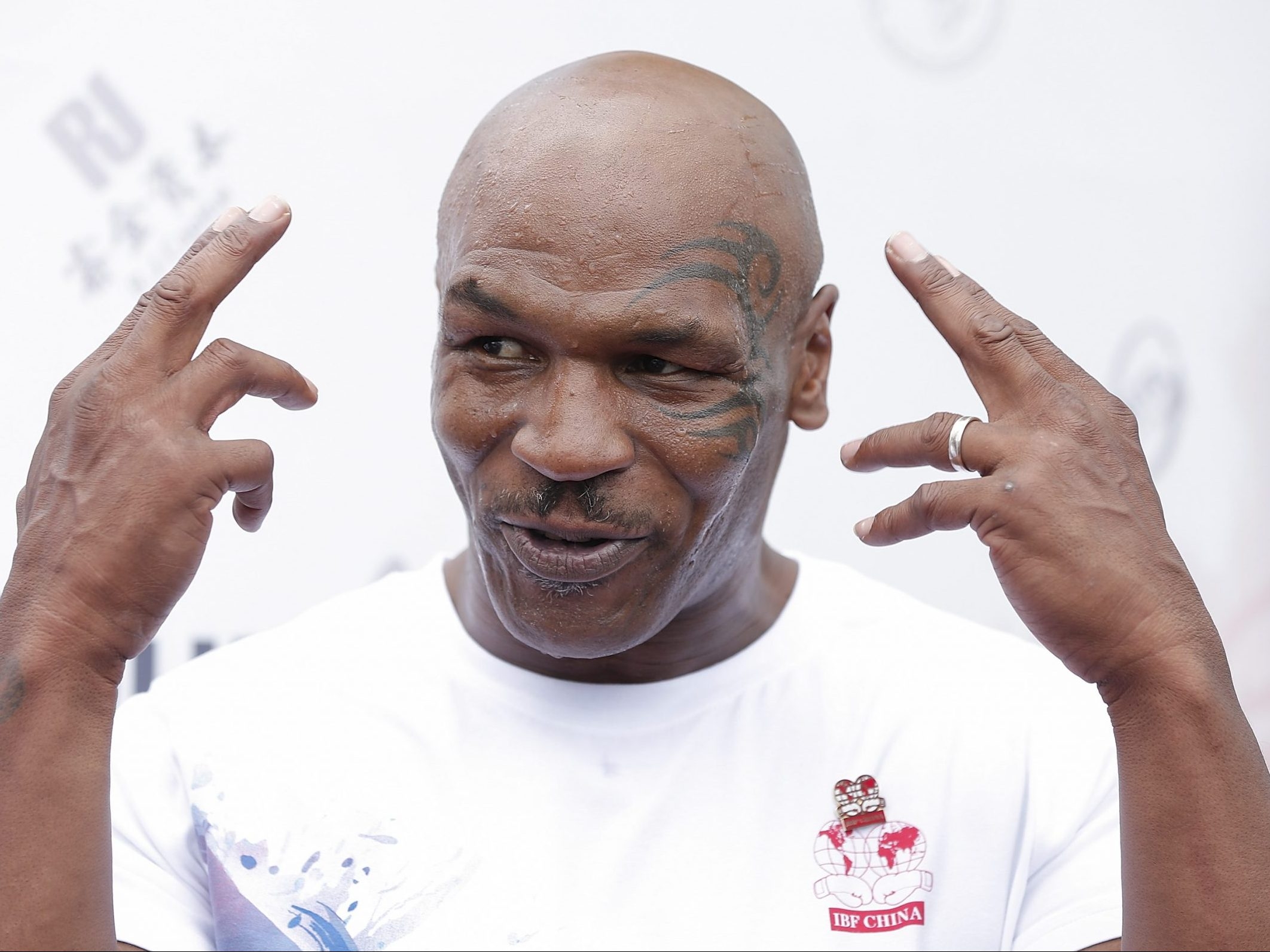 Video show where a woman shakes her finger on Mike Tyson’s face