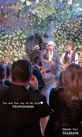 Dustin Johnson and Paulina Gretzky dance to Kid Rock at a wedding in a screenshot of a video posted in her Instagram story.