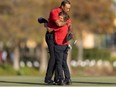 Tiger Woods and son Charlie Woods hug after the final round of the PNC Championship golf tournament at Grande Lakes Orlando Course.