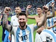 Argentina's Lionel Messi and teammates celebrate qualifying for the semifinals at the World Cup.