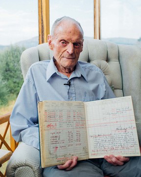 Donald “Doc” Payne in his Cowichan home with his pilot’s log book open to the page detailing his crash into the Baltic Sea on Friday the 13th of April, 1945.