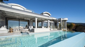 Enjoy outdoor living with an infiniti pool and a hot tub.
