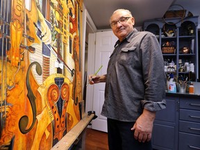 Local artist Dennis Smith is shown at his LaSalle home on Tuesday, February 22, 2022.