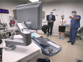 Windsor Mayor Drew Dilkens, left, and Ontario Health Minister Sylvia Jones are shown with Dr. Rahi Victory of Victory Reproductive Care at his fertility clinic in Windsor on Monday, September 26, 2022.