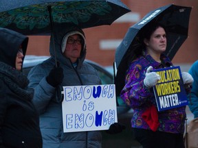 Education workers rally outside the Greater Essex County District School Board office in downtown Windsor to bring attention to support staff shortages on Tuesday, Oct. 18, 2022.