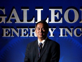 Former president Steve Sugianto poses with the Galleon Energy Inc. sign. The name is to be changed under new management.