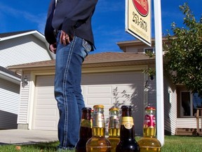 Calgary realtor Robyn Moser outside a home listed for sale that includes $1,000 in beer for the purchaser.