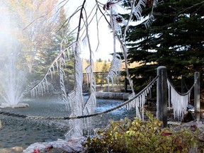 A running fountain at Eau Claire Market in Calgary is a sign of things to come as the overnight temperatures left a coat of ice on everything the water touched on Sunday October 16, 2011.