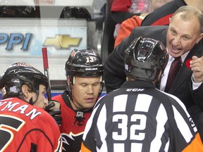 Calgary Flames coach Brent Sutter berates referee Tom Kowal after a second period Flames goal was disallowed against Nashville Predators at the Saddledome Saturday afternoon