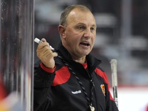 Brent Sutter conducts practice for the Flames