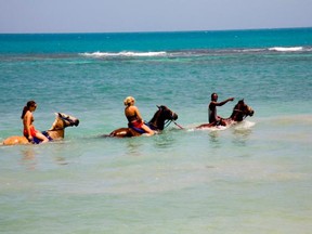 Riding horses at Font Hill Beach Park in Jamaica. Photo courtesy Jamaica Tourist Board