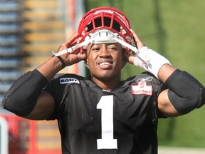 Stamps quarterback Henry Burris got the offence together for a post-practice meeting on Tuesday. Photo, Dean Bicknell, Calgary Herald.