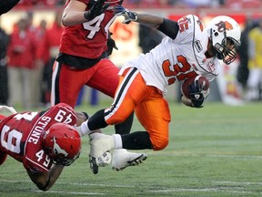 Calgary Stampeders' linebacker Daren Stone (wearing 49 during training camp) takes down B.C. Lions' Tim Brown in a pre-season game. Stone will get his first CFL start, at weak-side linebacker in place of Malik Jackson, on Saturday in Vancouver. Stuart Gradon, Calgary Herald
