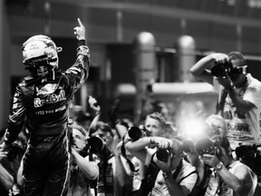 Sebastian Vettel celebrates in parc ferme after winning the Singapore Formula One Grand Prix at the Marina Bay Street Circuit on September 25, 2011 in Singapore.  (Photo by Ker Robertson, Getty Images)
