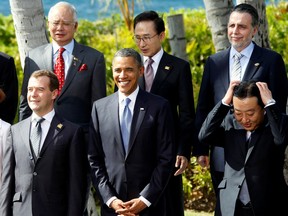 U.S. President Barack Obama is all smiles as Japanese Prime Minister Yoshihiko Noda runs his hands through his hair at a photo-op at the APEC Summit in Hawaii.