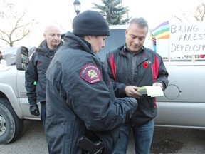 Cory Morgan learns city bylaws can be enforced during his visit to Olympic Plaza on Sunday.