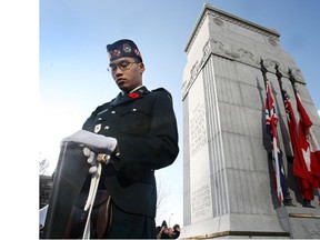 Vigil guard member Pte. David Nguyen stood guard over the cenotaph during the 2009 Remembrance Day ceremony.