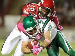 Stamps West Division all-star halfback Keon Raymond tackles Saskatchewan's Weston Dressler earlier this season. Photo, Leah Hennel, Calgary Herald