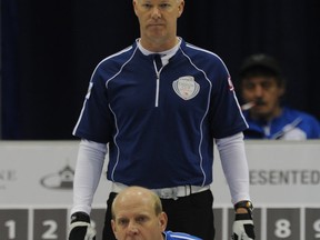 Glenn Howard looks on as Kevin Martin talks to his teammates during Sunday's Canada Cup final in Cranbrook. Photo, Michael Burns Jr., Canadian Curling Association