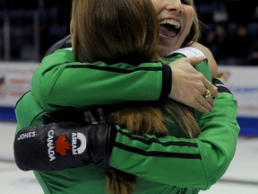 Jennifer Jones, right, hugs vice-skip Kaitlyn Lawes after their victory on Sunday in the Capital One Canada Cup of Curling in Cranbrook, B.C. Photo, Michael Burns, Canadian Curling Association