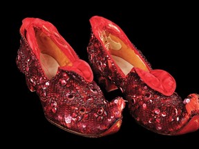 One of the surviving pairs of ruby red slippers worn by actress Judy Garland in the film The Wizard of Oz is shown in this publicity photo. Herald wire services.