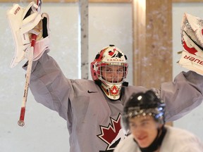 Goalie Mark Visentin celebrates during a Team Canada practice at the Rec Centre in Banff  on Saturday, December 17 2011.