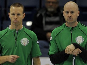 Pat Simmons, left, and Kevin Koe can start preparing for the Page playoff one-two game after their A-event final win over Kevin Martin on Thursday.