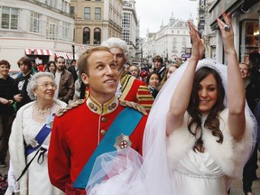 Many April Fool's Day hoaxes in 2011 focused on William and Kate, either eloping, breaking up or expecting a child. Here, royal look-alikes took to the streets on April 1, 2011, to entertain Londoners. Calgary Herald file photo