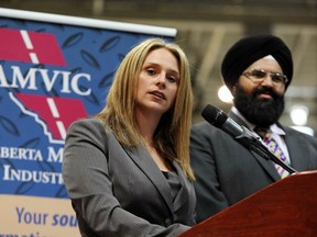 Manmeet Bhullar, Minister of Service Alberta and Nancy Suranyi chair of the Alberta Motor Vehicle Industry Council's (AMVIC) board of directors announced new consumer protection for consumers of automotive products and services at the Calgary auto show this week.