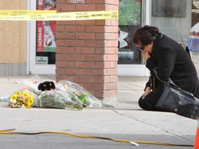 CALGARY, AB : MARCH 18, 2012 -  Maribel Gomez takes a moment to mourn for her son Mario, who was killed at  Sunset and Vine Pub on Sunday, March 18, 2012. He was stabbed to death early Saturday morning. City police  are asking for the public for help and encourage anyone with information to come forward.   (Lorraine Hjalte/Calgary Herald)