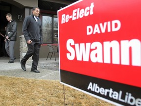 Alberta Liberal leader Raj Sherman, centre, and former leader David Swann door knocking in Calgary's Kensington neighbourhood this week. Grant Black, Calgary Herald