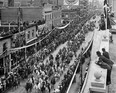 This photo shows the crowds that turned out for the very first Calgary Stampede parade, as it moves along 8th Avenue South. Courtesy Glenbow Museum Archives, #NA-4035-91