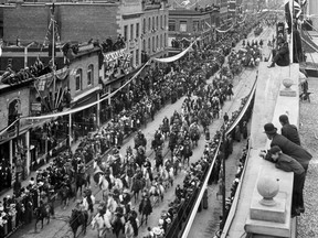 This photo shows the crowds that turned out for the very first Calgary Stampede parade, as it moves along 8th Avenue South. Courtesy Glenbow Museum Archives, #NA-4035-91