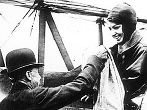 Aviator Katherine Stinson was a featured act at the 1916 Industrial Exhibition in Calgary. This is Stinson in 1918 receiving a bag of mail in Calgary which she would fly to Edmonton.
Courtesy, Glenbow Archives