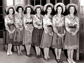 In 1942 Eaton's elevator operators were decked out in their finest western duds.  I guess cowboy boots weren't part of the look!  Herald file photo.